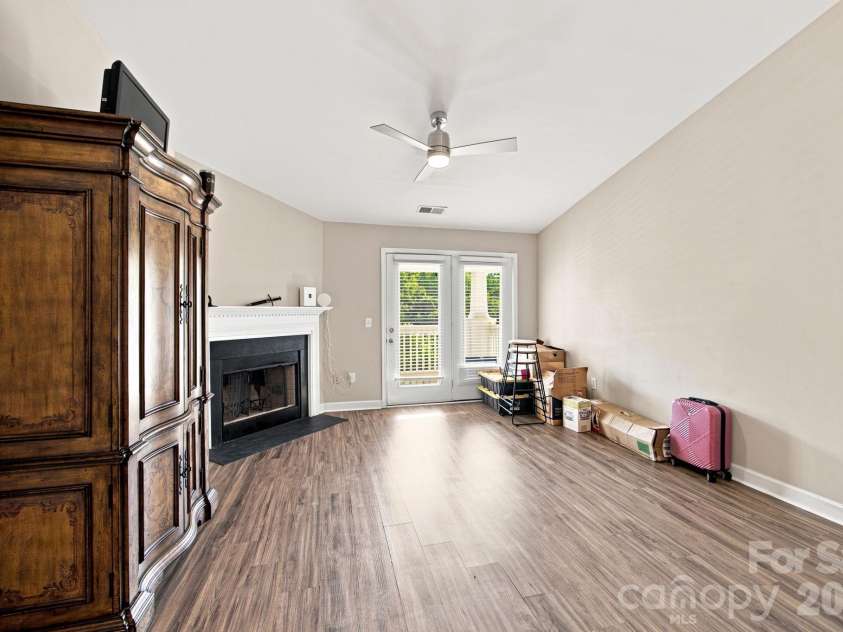 17257 Doe Valley Court, Cornelius, NC 28031.  MLS# CAR4405908, YatesRealty ID 39617. Living Area w/ Vaulted Ceilings & Fireplace