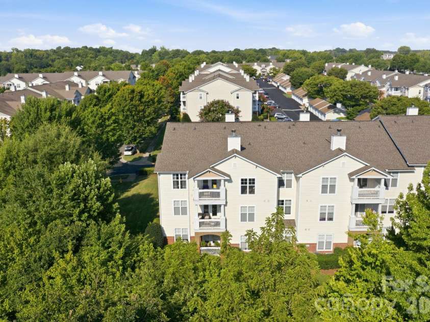 17257 Doe Valley Court, Cornelius, NC 28031.  MLS# CAR4405908, YatesRealty ID 39617. Top Floor Corner Unit surrounded by large, mature, trees