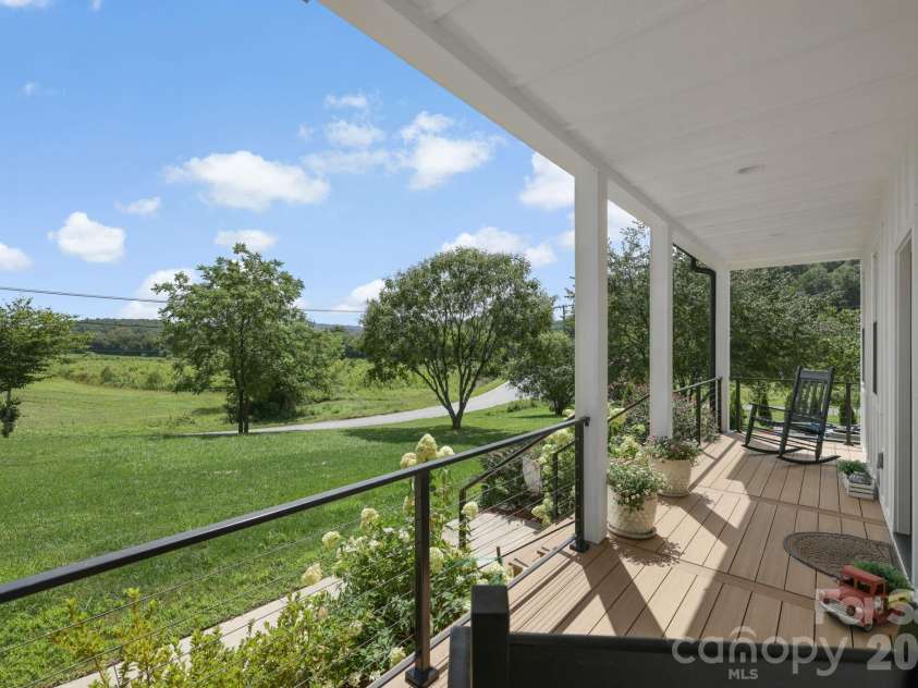 29 Banner Cottages Lane, Mills River, NC 28759.  MLS# CAR4406330, YatesRealty ID 39636. Covered front porch, trex decking