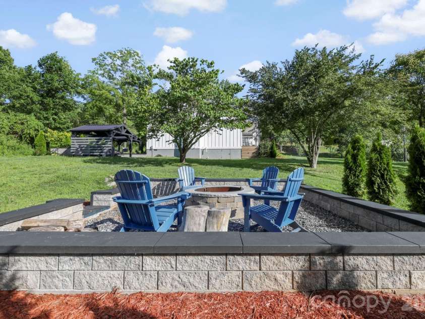 29 Banner Cottages Lane, Mills River, NC 28759.  MLS# CAR4406330, YatesRealty ID 39636. Spacious custom firepit added