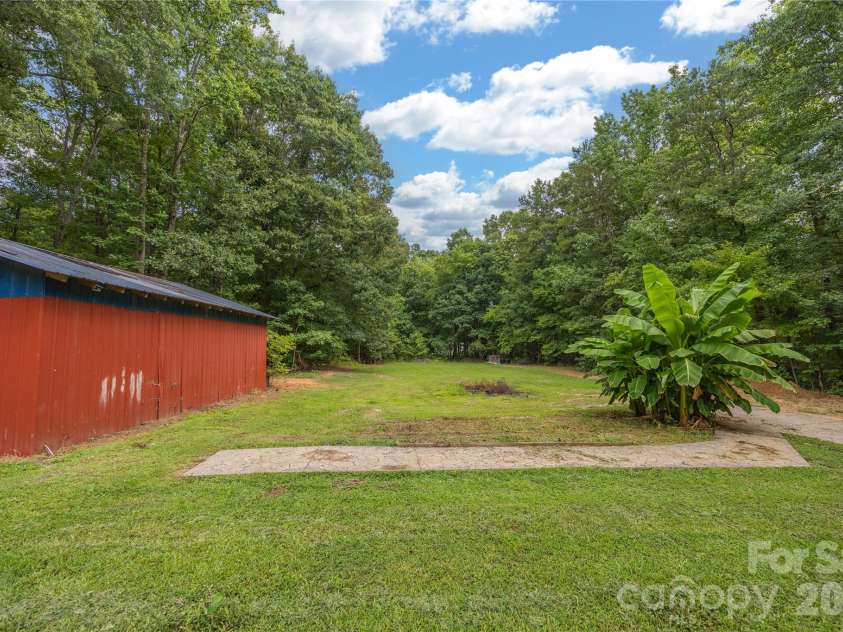 703 Chapel Hill Church Road, Denton, NC 27239.  MLS# CAR4407033, YatesRealty ID 39648. Back yard