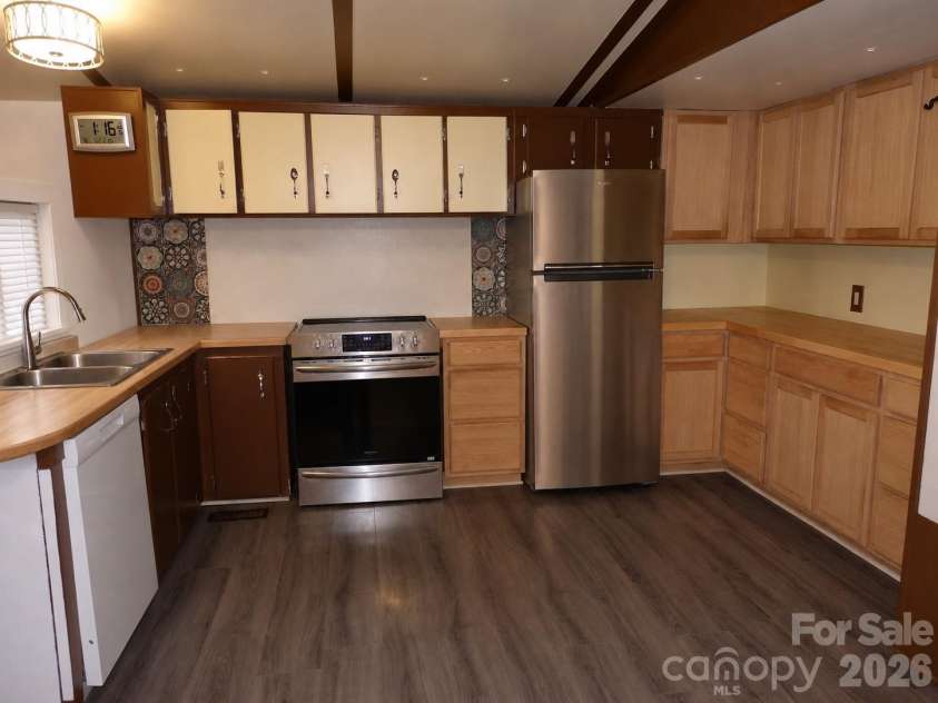 703 Chapel Hill Church Road, Denton, NC 27239.  MLS# CAR4407033, YatesRealty ID 39648. Kitchen with dishwasher and refigerator