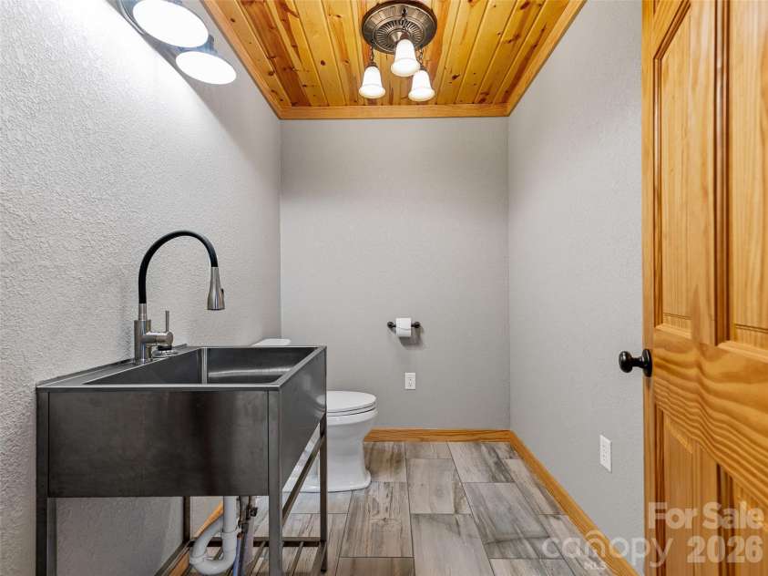 143 Fox Grape Hollow Road, Mars Hill, NC 28754.  MLS# CAR4397871, YatesRealty ID 39652. Large Half Bath behind kitchen with pulmbing for bath