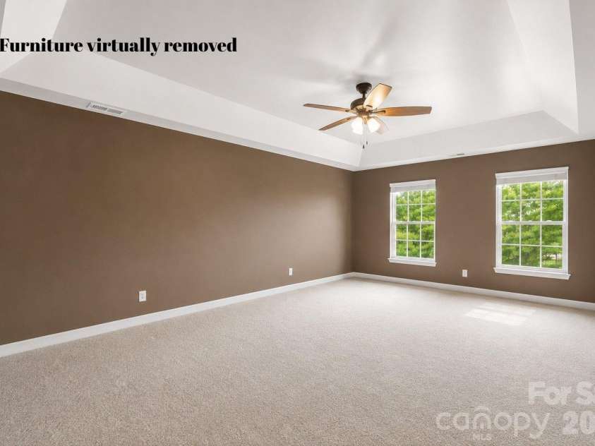 1086 Arrowhead Drive, Concord, NC 28025.  MLS# CAR4397947, YatesRealty ID 39653. Primary bedroom with furniture virtually removed