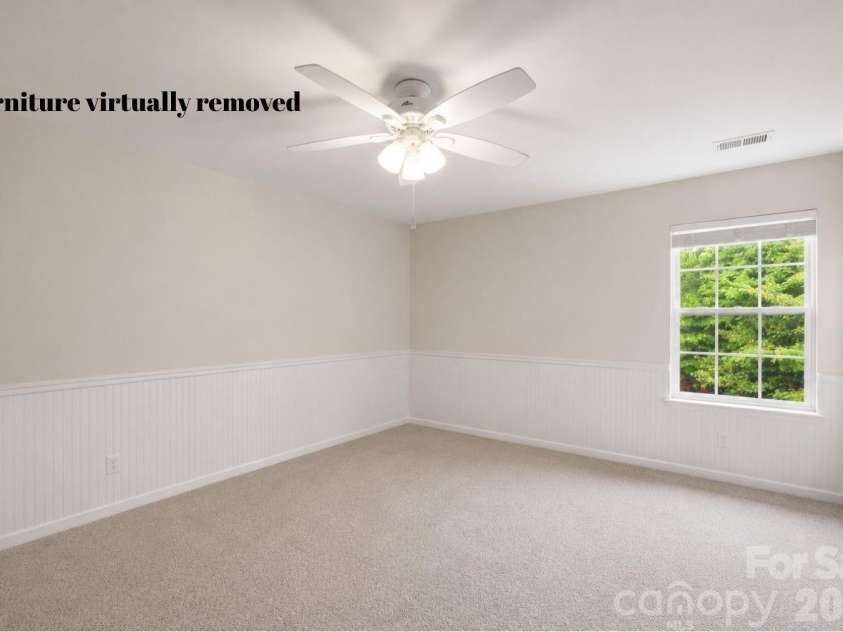 1086 Arrowhead Drive, Concord, NC 28025.  MLS# CAR4397947, YatesRealty ID 39653. Secondary bedroom #2 with furniture virtually removed