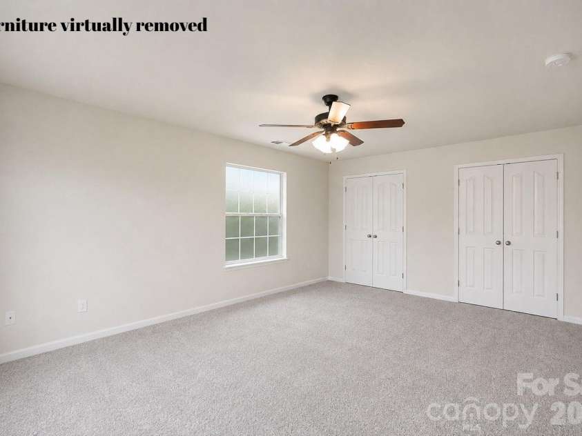 1086 Arrowhead Drive, Concord, NC 28025.  MLS# CAR4397947, YatesRealty ID 39653. Secondary bedroom #3 with furniture virtually removed
