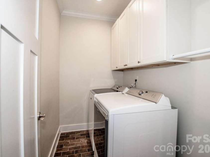 155 Wood Acre Drive, Mooresville, NC 28115.  MLS# CAR4398730, YatesRealty ID 39664. Laundry with custom cabinets on main