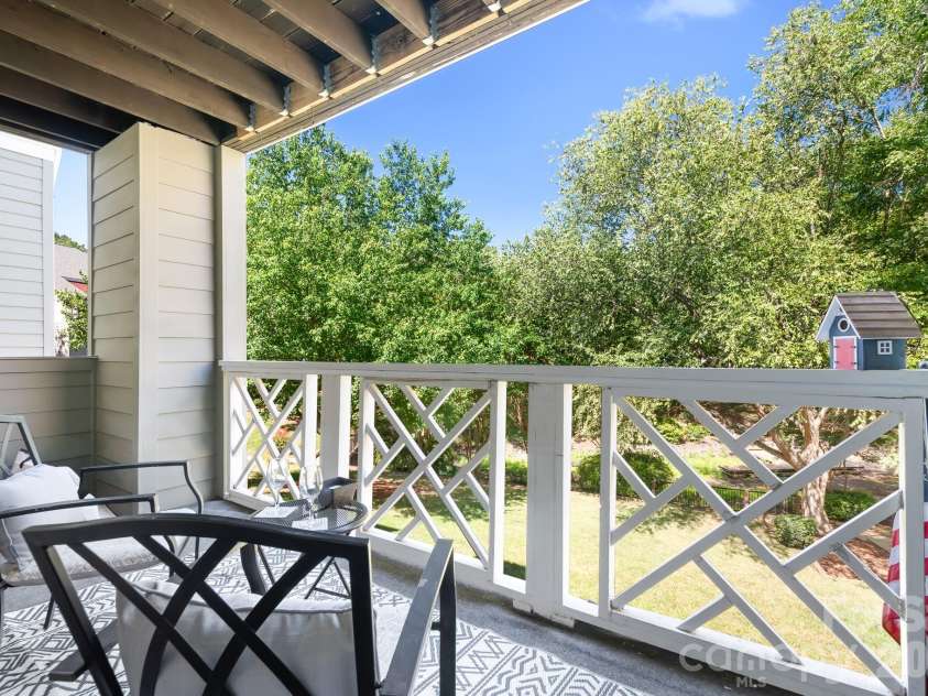 19843 Henderson Road, Cornelius, NC 28031.  MLS# CAR4400549, YatesRealty ID 39667. Balcony Looking South - Mature Trees and Grassy Areas