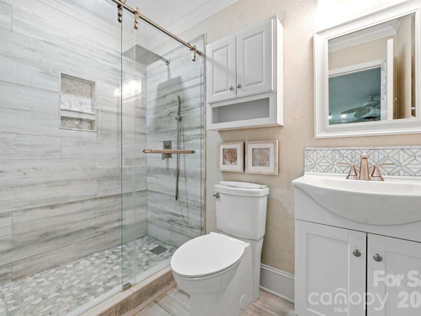 12017 Baywoods Drive, Tega Cay, SC 29708.  MLS# CAR4407015, YatesRealty ID 39706. Lower level full bathroom