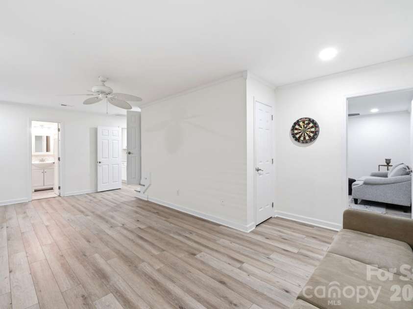 12017 Baywoods Drive, Tega Cay, SC 29708.  MLS# CAR4407015, YatesRealty ID 39706. Lower level great room