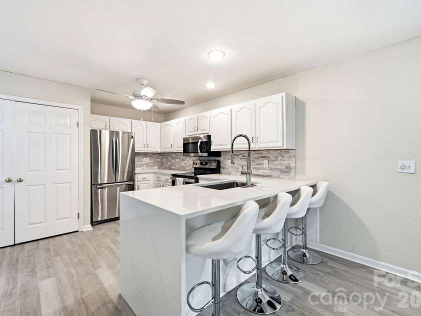12017 Baywoods Drive, Tega Cay, SC 29708.  MLS# CAR4407015, YatesRealty ID 39706. Main level kitchen