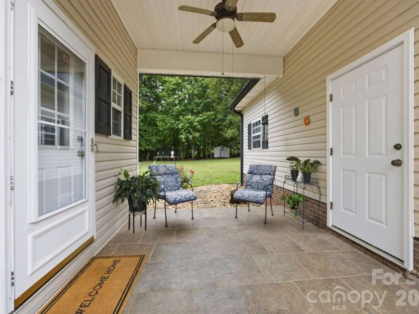 7073 Ridgeway Road, Stanley, NC 28164.  MLS# CAR4406988, YatesRealty ID 39719. Breezeway between the garage and side entrance to the laundry room