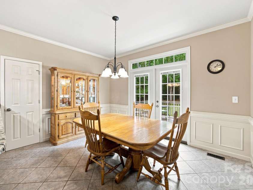 7073 Ridgeway Road, Stanley, NC 28164.  MLS# CAR4406988, YatesRealty ID 39719. Dining room with access to the walk-in pantry and deck