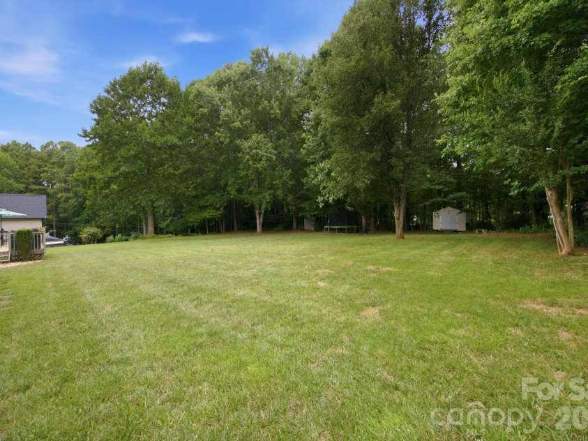 7073 Ridgeway Road, Stanley, NC 28164.  MLS# CAR4406988, YatesRealty ID 39719. Huge, flat yard with tree line at the rear
