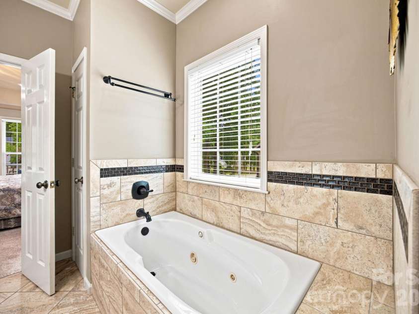 7073 Ridgeway Road, Stanley, NC 28164.  MLS# CAR4406988, YatesRealty ID 39719. Primary bath Jacuzzi tub