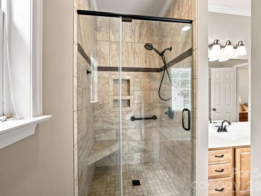 7073 Ridgeway Road, Stanley, NC 28164.  MLS# CAR4406988, YatesRealty ID 39719. Primary bath tiled shower