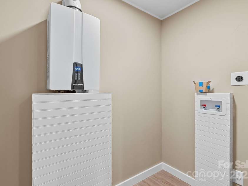 530 Rebel Ridge Road, Marshall, NC 28753.  MLS# CAR4280737, YatesRealty ID 3972. Separate laundry room off kitchen w/brand new tankless hot water heater and all new plumbing throughout 