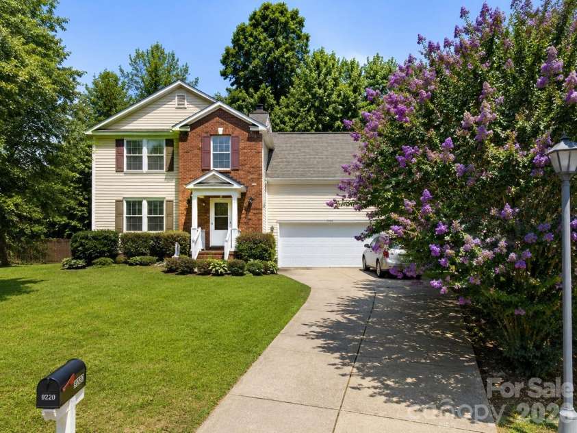 9220 Garnet Field Court, Charlotte, NC 28269.  MLS# CAR4407211, YatesRealty ID 39722. Front view altered to remove large tree