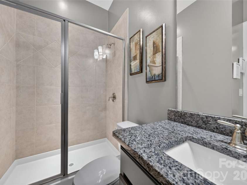 5110 Harwich Circle, Matthews, NC 28104.  MLS# CAR4406982, YatesRealty ID 39744. Guest Suite on Main Full Bath