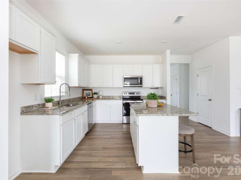 507 Good Hope Road, Concord, NC 28025.  MLS# CAR4407350, YatesRealty ID 39745. Seating at your kitchen island plus a dedicated dining area.