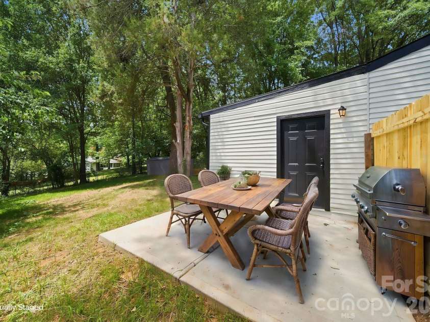8114 Holly Hill Road, Charlotte, NC 28227.  MLS# CAR4407427, YatesRealty ID 39748. Back Patio- Virtually staged