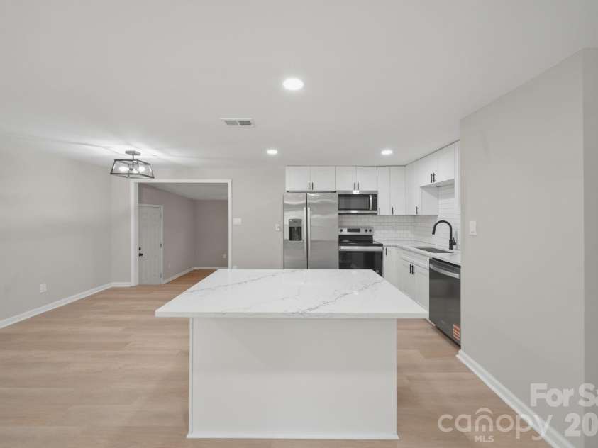 8114 Holly Hill Road, Charlotte, NC 28227.  MLS# CAR4407427, YatesRealty ID 39748. Kitchen/ Den entry