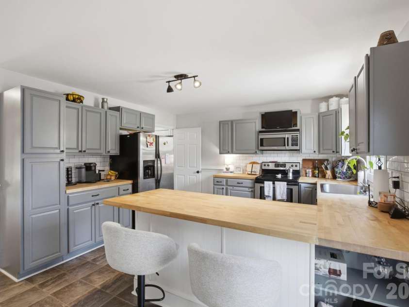 63 Frost Lane, Taylorsville, NC 28681.  MLS# CAR4407455, YatesRealty ID 39749. Kitchen with breakfast bar