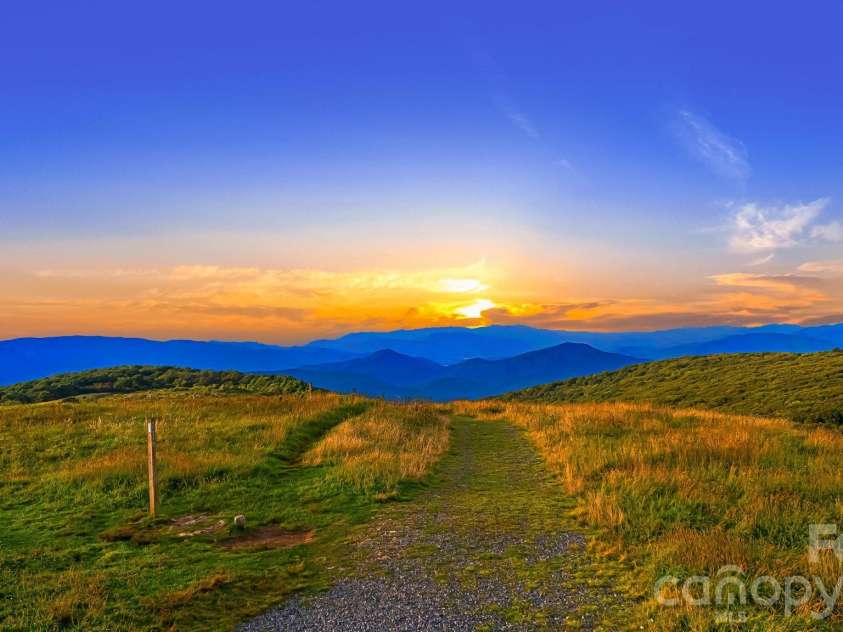 156 Cottage Lane, Mars Hill, NC 28754.  MLS# CAR4406570, YatesRealty ID 39759. Big Bald Sunsets