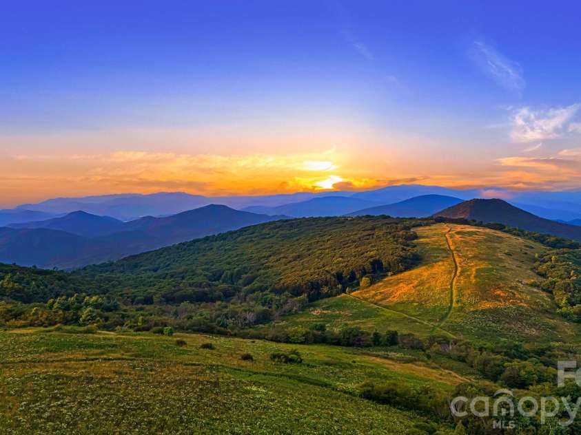 156 Cottage Lane, Mars Hill, NC 28754.  MLS# CAR4406570, YatesRealty ID 39759. Big Bald Sunsets