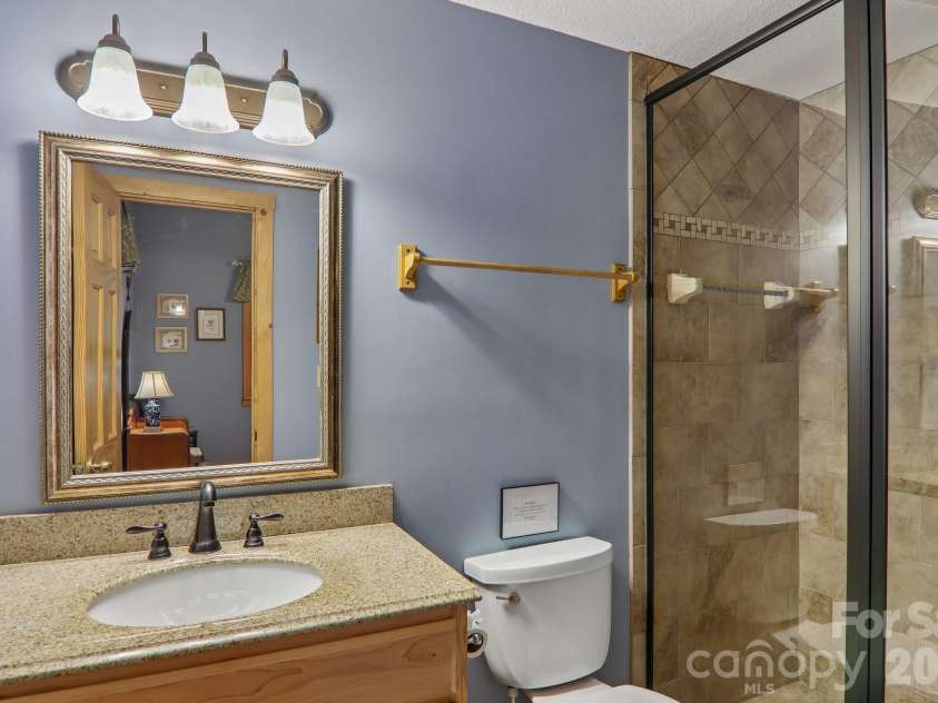 156 Cottage Lane, Mars Hill, NC 28754.  MLS# CAR4406570, YatesRealty ID 39759. Ensuite primary bath