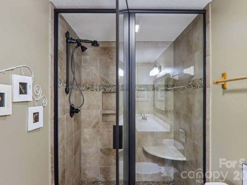 156 Cottage Lane, Mars Hill, NC 28754.  MLS# CAR4406570, YatesRealty ID 39759. Lower level primary bathroom 3