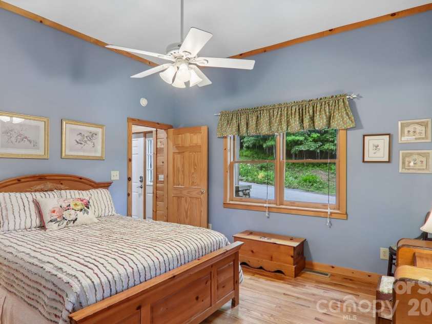 156 Cottage Lane, Mars Hill, NC 28754.  MLS# CAR4406570, YatesRealty ID 39759. Main level primary bedroom