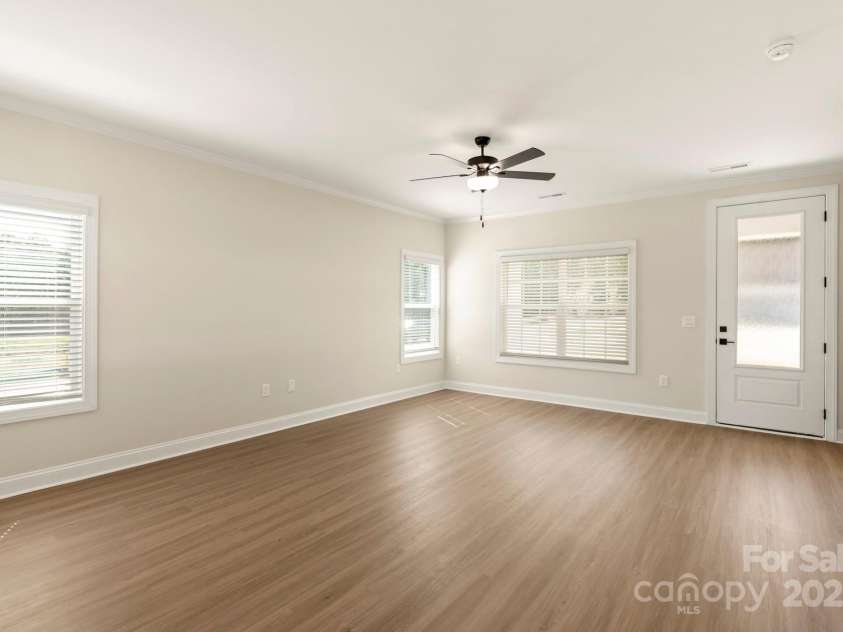 124 Rills Crossing Way, Troutman, NC 28166.  MLS# CAR4334341, YatesRealty ID 3976. Family room