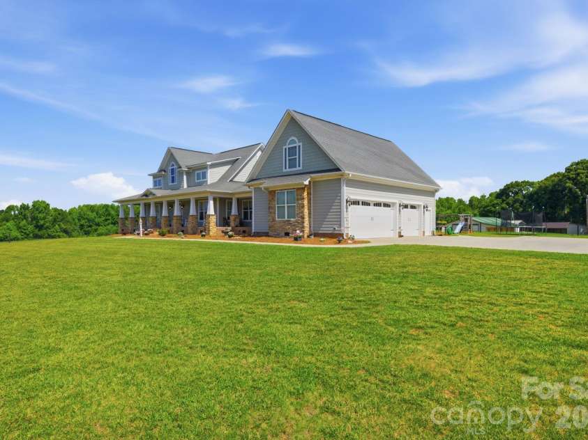 212 Scism Road, Kings Mountain, NC 28086.  MLS# CAR4406488, YatesRealty ID 39765. Side load oversized three car garage with mini split and large concrete parking pad