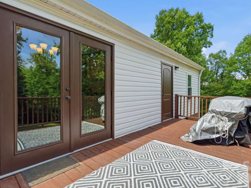 3307 Baltimore Road, East Bend, NC 27018.  MLS# CAR4406336, YatesRealty ID 39767. Deck overlooking Backyard