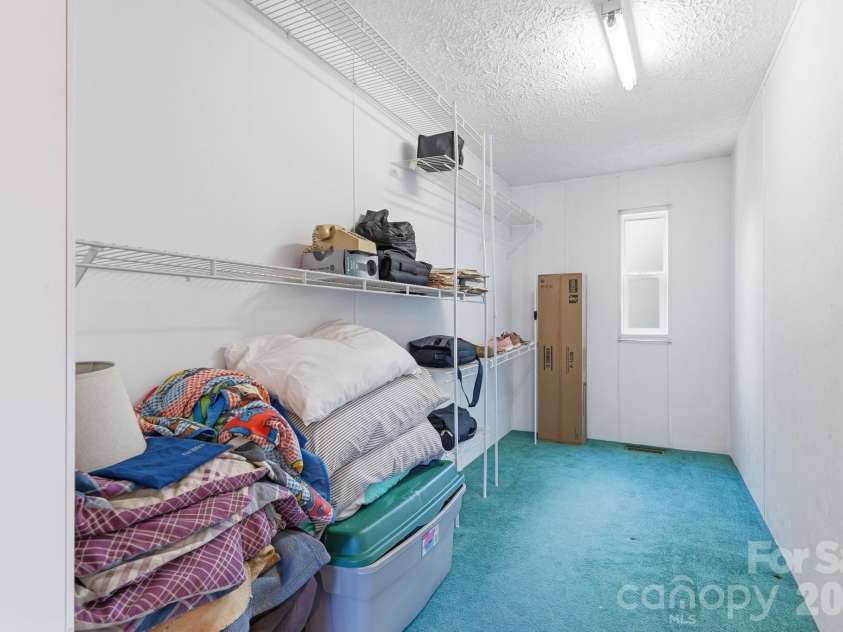 3307 Baltimore Road, East Bend, NC 27018.  MLS# CAR4406336, YatesRealty ID 39767. Primary Bedroom's Walk-in Closet