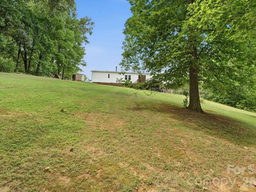 3307 Baltimore Road, East Bend, NC 27018.  MLS# CAR4406336, YatesRealty ID 39767. Spacious Backyard with year round views!!
