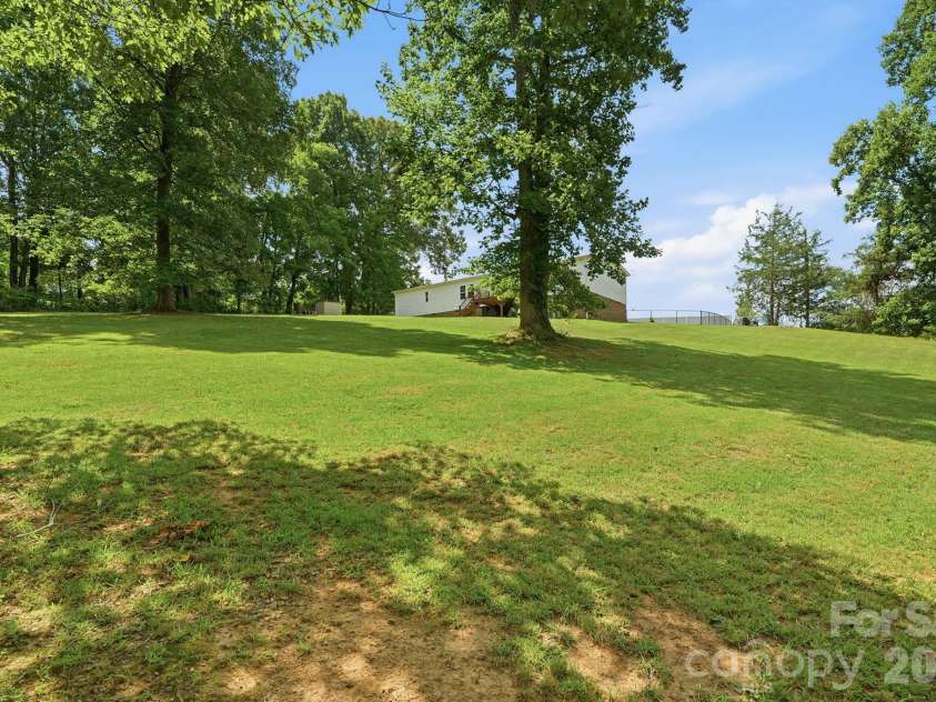 3307 Baltimore Road, East Bend, NC 27018.  MLS# CAR4406336, YatesRealty ID 39767. Spacious Backyard with year round views!!