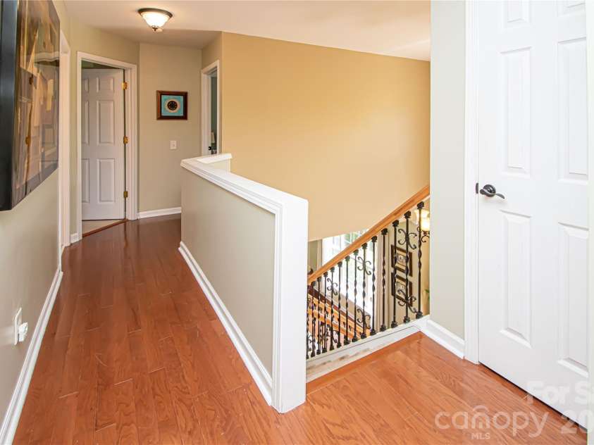 14114 Eldon Drive, Charlotte, NC 28277.  MLS# CAR4406225, YatesRealty ID 39773. Upper hallway has laminate wood floors.