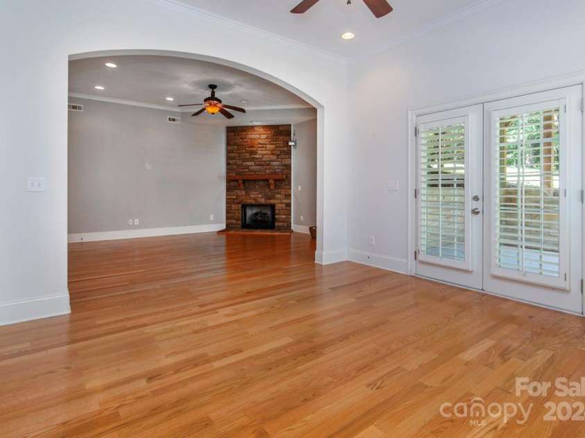 4709 Trey View Court, Mint Hill, NC 28227.  MLS# CAR4173427, YatesRealty ID 3978. Arched opening from  office/game room to family gathering room with sone fp/gas logs.