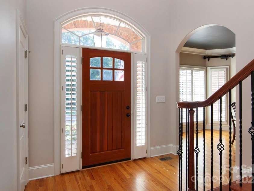4709 Trey View Court, Mint Hill, NC 28227.  MLS# CAR4173427, YatesRealty ID 3978. Arched opening to DR, elegant HW stair flight to all HR landing