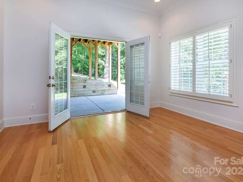 4709 Trey View Court, Mint Hill, NC 28227.  MLS# CAR4173427, YatesRealty ID 3978. Basement concrete patio under upstairs deck. Dbl French doors to office or game rm - you decide - daylight windows, Plantation shutteres