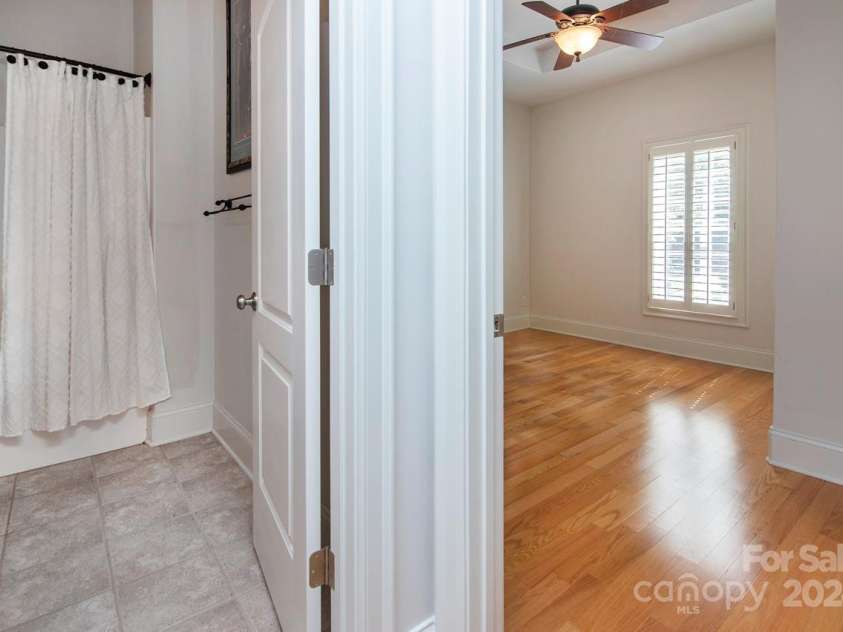 4709 Trey View Court, Mint Hill, NC 28227.  MLS# CAR4173427, YatesRealty ID 3978. View of basement FBA & BR (entire basement is engineered HW floors). Tray ceiling & fan/light in BR, dbl dr closet. Daylight window!