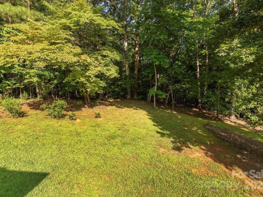 4709 Trey View Court, Mint Hill, NC 28227.  MLS# CAR4173427, YatesRealty ID 3978. View of private bkyd and bordering treed HF common area - Unique private lot!