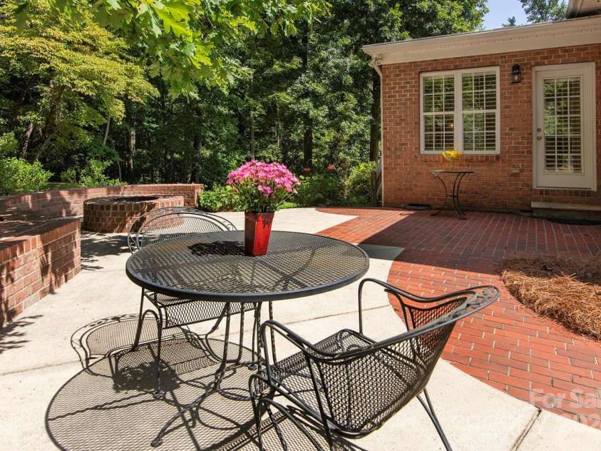 4709 Trey View Court, Mint Hill, NC 28227.  MLS# CAR4173427, YatesRealty ID 3978. Wow! Custom brick wall/round firepit! Brick pavers lead to deck! Sunroom door opens to patio!
