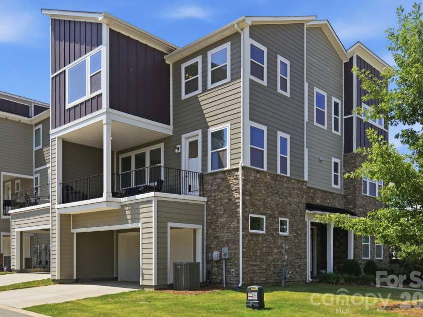 2745 Ensemble Court, Charlotte, NC 28262.  MLS# CAR4405842, YatesRealty ID 39785. Covered area over garage entrance