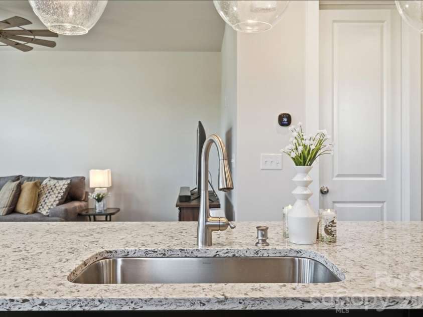 2745 Ensemble Court, Charlotte, NC 28262.  MLS# CAR4405842, YatesRealty ID 39785. Neutral granite, white with earth tones