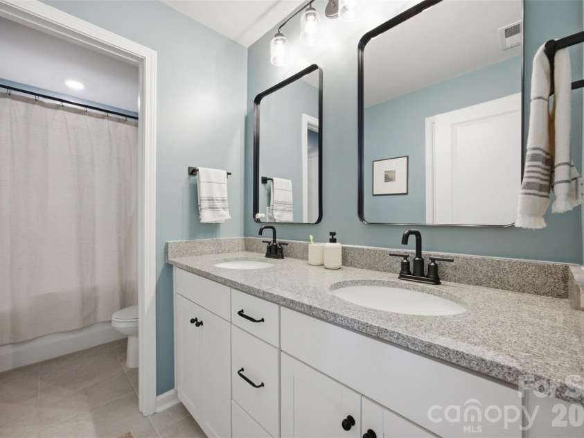 5821 Casper Drive, Charlotte, NC 28214.  MLS# CAR4405553, YatesRealty ID 39797. Full bathroom on the upper level.