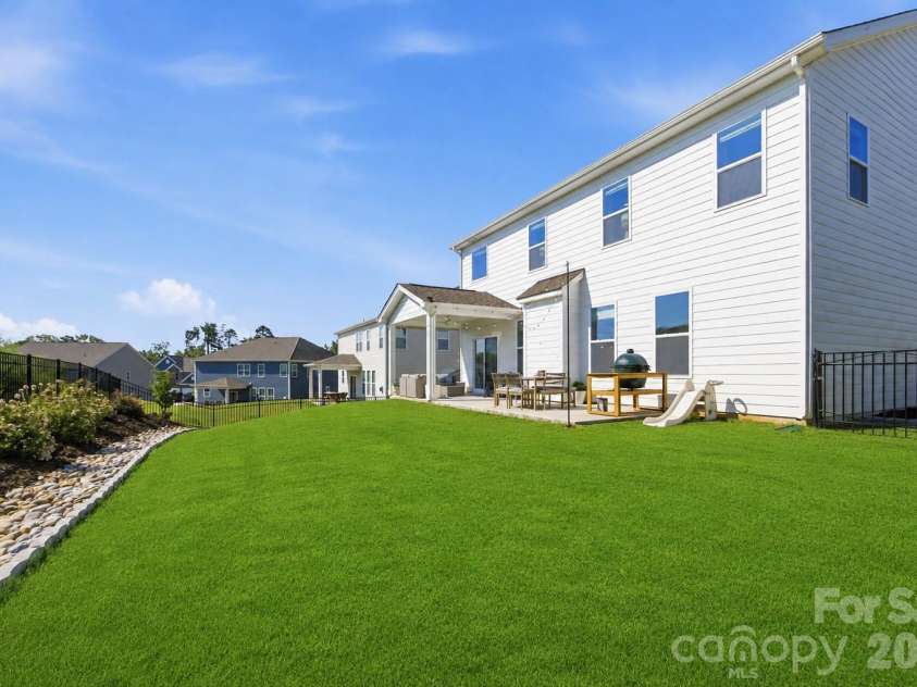 5821 Casper Drive, Charlotte, NC 28214.  MLS# CAR4405553, YatesRealty ID 39797. Fully fenced in back yard with extensive landscaping and irrigation.