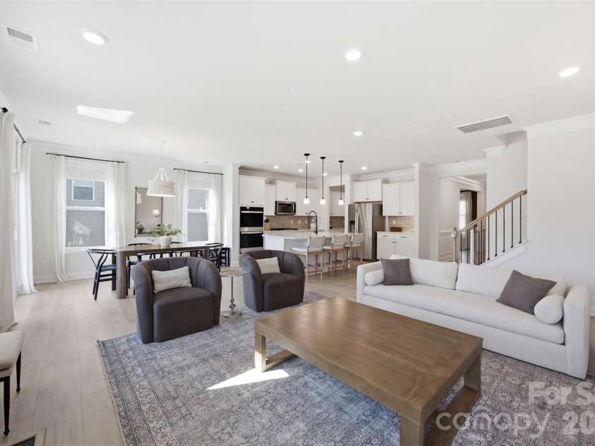 5821 Casper Drive, Charlotte, NC 28214.  MLS# CAR4405553, YatesRealty ID 39797. Large, open concept living room.